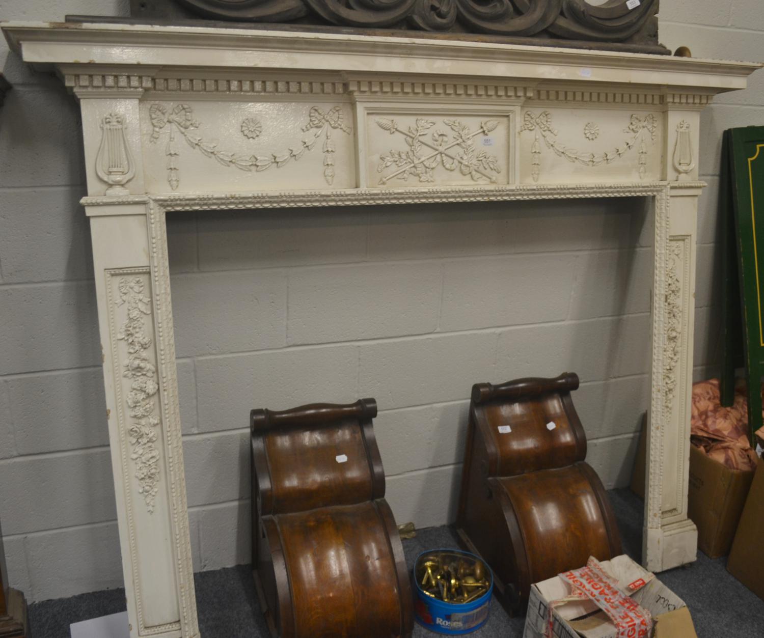 White painted fireplace decorated with swags