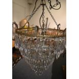 A gilt metal chandelier with glass drops