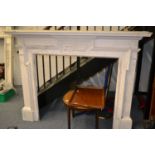 White painted fireplace with acorn decoration