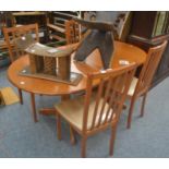 Set of four dining chairs by The Morris Furniture Company and matching extending table