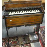 Small oak and ebonised organ with two pedals