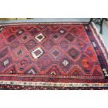 Kurdish rug, Persian Kurdistan, the tomato red stepped lattice field of serrated guls enclosed by