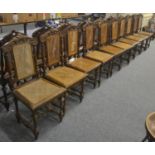 A set of ten late 19th century oak dining chairs with bergère backs and seats