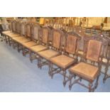 A set of ten late 19th century oak dining chairs with bergère backs and seats