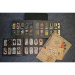 A collection of assorted cigarette cards