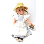 Heubach Koppelsdorf '250' bisque socket head doll, with blond plaits, sleeping blue eyes, on a