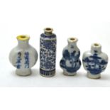 Four Chinese blue and white snuff bottles Small examples with various fritting/chips, larger example