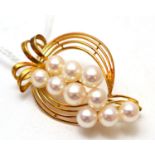 A cultured pearl brooch, by Mikimoto, stamped 'K14'