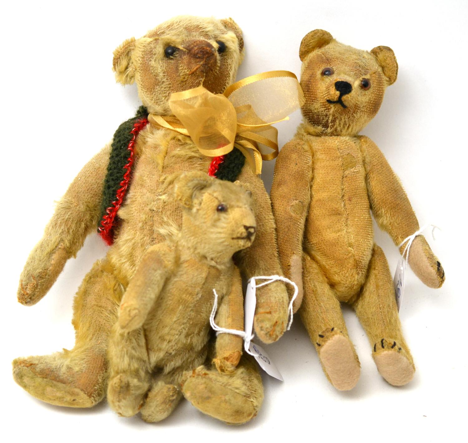 Circa 1905 yellow mohair small Steiff teddy bear with jointed body, humped back, brown stitched