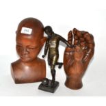 A bronze statue of a footballer monogrammed to base KM, together with a wooden bust signed and dated