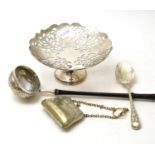 A walrus ivory okimono, a silver mounted toddy ladle and three silver plated items