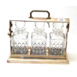 A Mappin & Webb silver plated three decanter tantalus