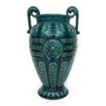 2059 A Linthorpe Pottery Twin-Handled Vase, moulded with a floral repeating pattern, covered in a