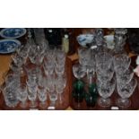 Two trays of modern cut drinking glasses, port, champagne, sherry etc and decanters