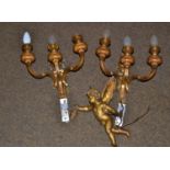 A pair of three branch gilt metal wall lights and a cherub