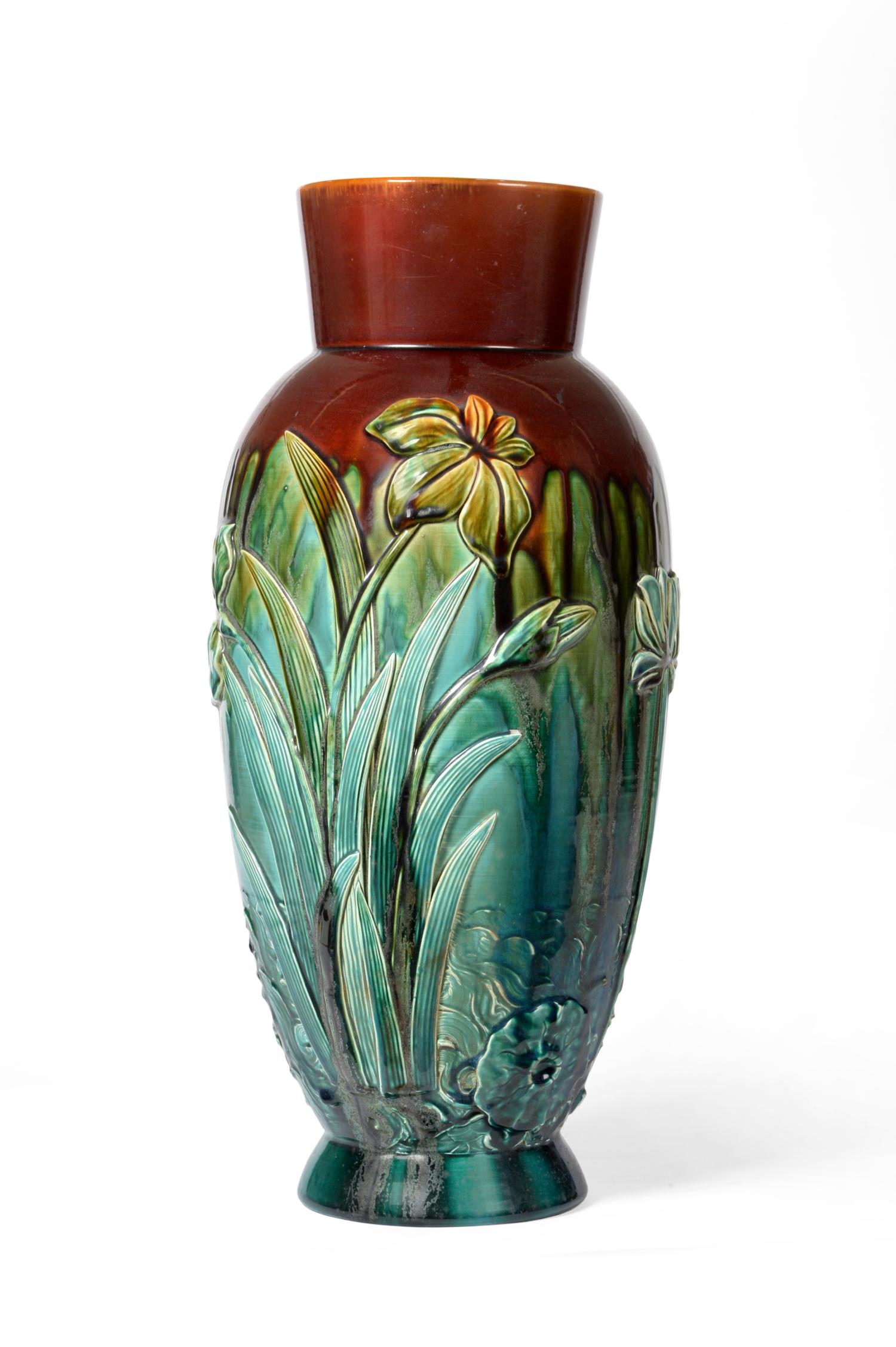 168 Christopher Dresser for Linthorpe Pottery: A Vase, shape No.168, moulded with iris, daffodil and