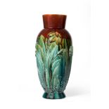 168 Christopher Dresser for Linthorpe Pottery: A Vase, shape No.168, moulded with iris, daffodil and