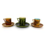 639 640 Christopher Dresser for Linthorpe Pottery: A Cup and Saucer, decorated with flowers,