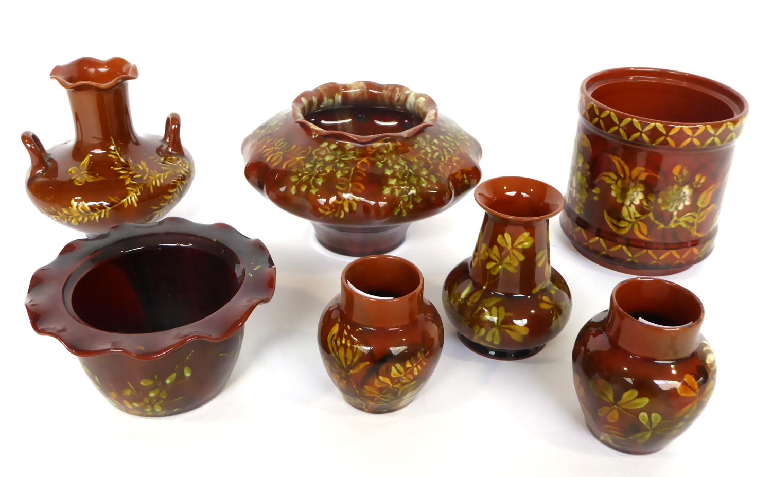 46 812 1318 2162 2165 2206 A Group of Seven Pieces of Linthorpe Pottery, all decorated with flowers,