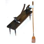 A Wood and Iron Knurr and Spell Trap, with wooden club and balls, length 59cm