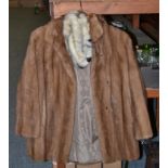 Light brown mink jacket with shaped hem, Mitzi Lorenz mink hat with brown suede lace detailing,
