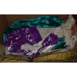 Chinese purple silk jacket with cream embroidery and tassel trims, two Chinese style green brocade