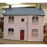 Pink painted dolls house and box of assorted furniture
