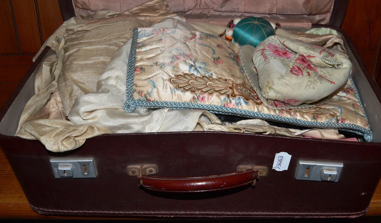 Case including Chinese cream silk panel embroidered in coloured silks, pair of child's red silk