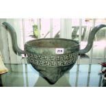 Large Chinese bronze tripod censer having two curved handles with a relief border of swastika