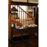 18thC English oak dresser with open back plate rack above three drawers and a potboard shelf