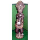 African carved wood figure with woven raffia belt, 17" tall