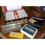 Cased set of Terry's metal dominoes, a boxed Universal Map Measurer, a Mah Jong set and other