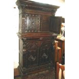19th c. carved oak buffet having two carved & panelled doors to top enclosing fitted interior with