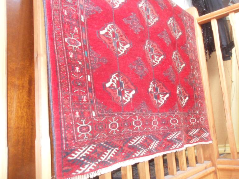 "Balouch" rug with a deep red ground, handmade in Iran, 153cm x 120cm