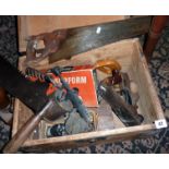 Wooden box of old tools, and a two-handled crosscut saw