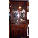 19th c secretaire bookcase with glazed upper section and fitted interior above two cupboard doors