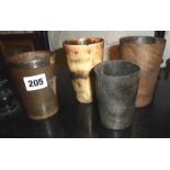 Four horn beakers, one with silver mounts