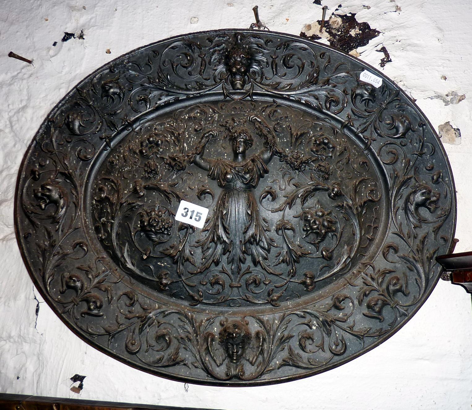 Ornate 19th c cast iron oval plaque by the American Radiator Company, depicting a classical figure