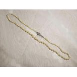 A single strand of cultured pearl neckla