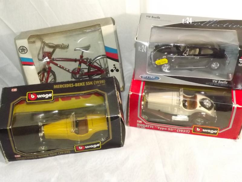 Four boxed die-cast model motor vehicles