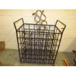 A wrought iron wine rack supported on ca