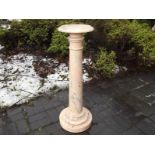 A solid pink marble column 93cm (h) x 27