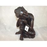 A bronzed figure depicting a Buddha 28cm