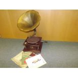 A vintage horn gramophone and sheet musi