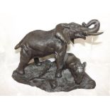 A bronzed figure depicting an elephant a
