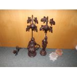 Two bronzed table lamps with figurines o