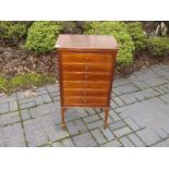 A good quality mahogany music cabinet on