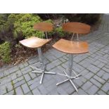 Two modern bar stools with chrome plated