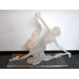 A frosted figurine depicting a female da