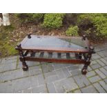 A mahogany coffee table with glass inser